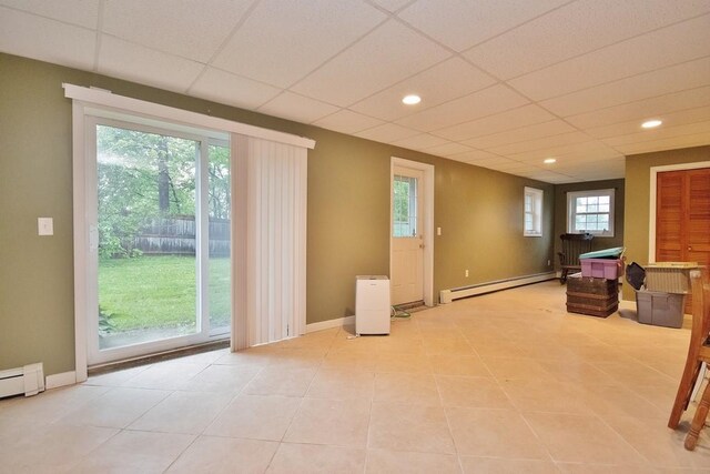 135 Cottage Rd, Carmel, NY 10512 - basement with a baseboard radiator, light tile patterned floors, recessed lighting, a paneled ceiling, and baseboards