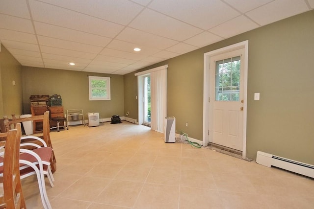 135 Cottage Rd, Carmel, NY 10512 - interior space featuring light tile patterned flooring, a drop ceiling, baseboard heating, a baseboard heating unit, and recessed lighting
