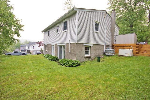 135 Cottage Rd, Carmel, NY 10512 - rear view of property featuring a lawn and a chimney