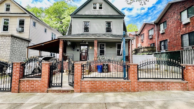 4308 68th St Unit 2Family, Woodside, NY 11377 - view of front of house featuring a porch, a fenced front yard, and a gate