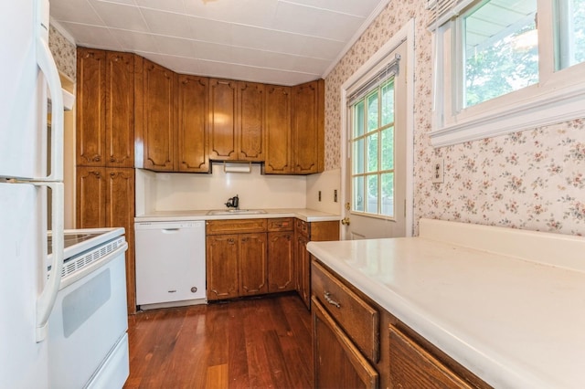769 Anderson Ave, Franklin Square, NY 11010 - kitchen featuring white appliances, wallpapered walls, brown cabinetry, dark wood-type flooring, and light countertops