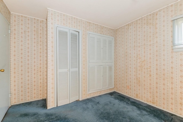 769 Anderson Ave, Franklin Square, NY 11010 - unfurnished bedroom featuring crown molding, carpet floors, and a closet