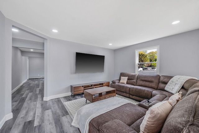 73 S Evergreen Dr, Selden, NY 11784 - living room with wood finished floors, baseboards, and recessed lighting