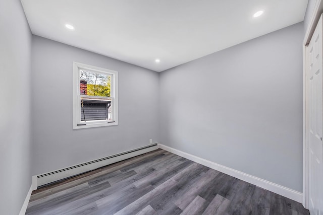 73 S Evergreen Dr, Selden, NY 11784 - unfurnished room featuring dark wood-style flooring, recessed lighting, baseboards, and a baseboard heating unit