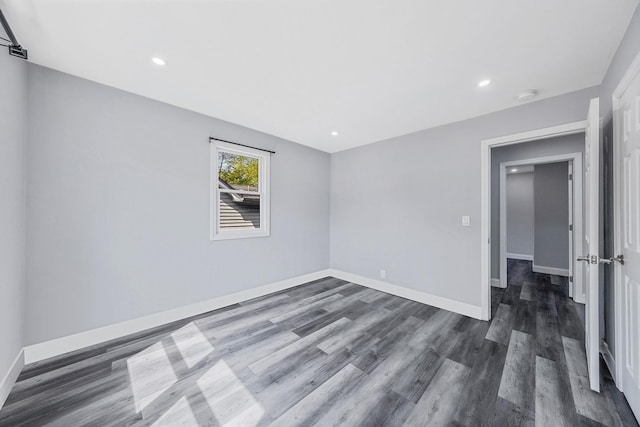 73 S Evergreen Dr, Selden, NY 11784 - spare room with baseboards, dark wood finished floors, and recessed lighting