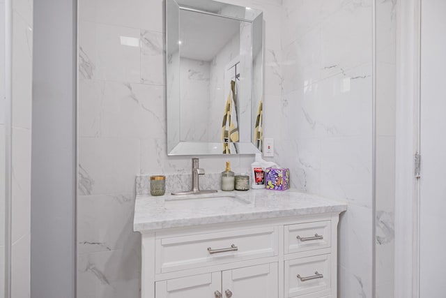 73 S Evergreen Dr, Selden, NY 11784 - bathroom with vanity and tile walls