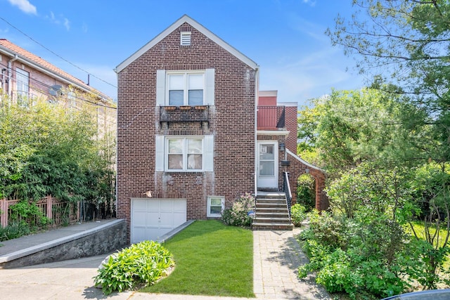 2330 Kingsland Ave, Bronx, NY 10469 - view of front facade featuring brick siding, a garage, driveway, and a front yard