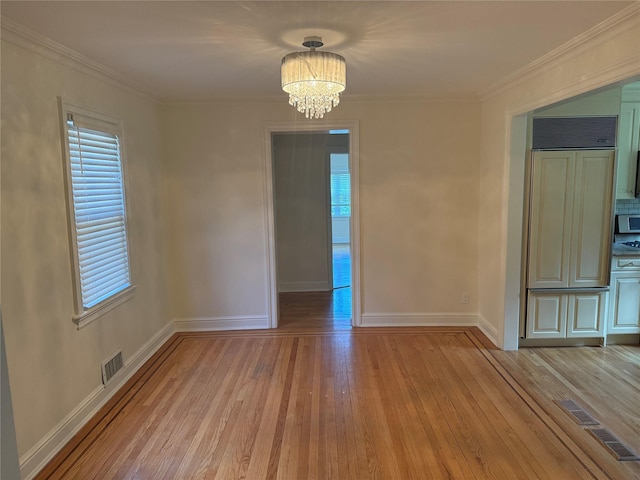 2330 Kingsland Ave, Bronx, NY 10469 - unfurnished room with a chandelier, light wood-type flooring, baseboards, and crown molding