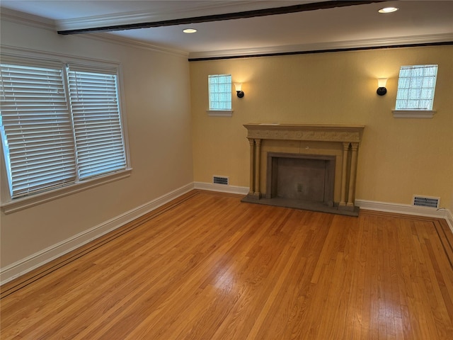 2330 Kingsland Ave, Bronx, NY 10469 - unfurnished living room with ornamental molding, light wood-style flooring, a fireplace with raised hearth, baseboards, and recessed lighting