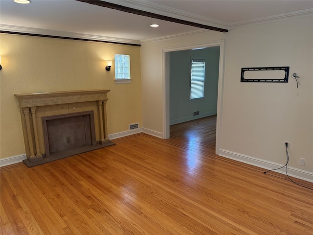 2330 Kingsland Ave, Bronx, NY 10469 - unfurnished living room featuring ornamental molding, a fireplace with raised hearth, light wood-style floors, baseboards, and recessed lighting