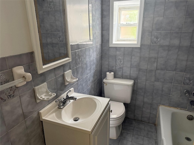 2330 Kingsland Ave, Bronx, NY 10469 - full bath with tile walls, a tub, tile patterned flooring, toilet, and vanity