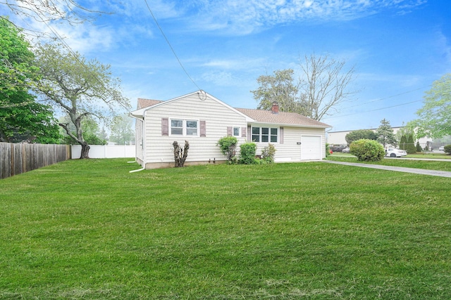 view of front of home featuring a chimney, a garage, and driveway