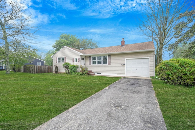 ranch-style home with a chimney, a garage, driveway, and a shingled roof