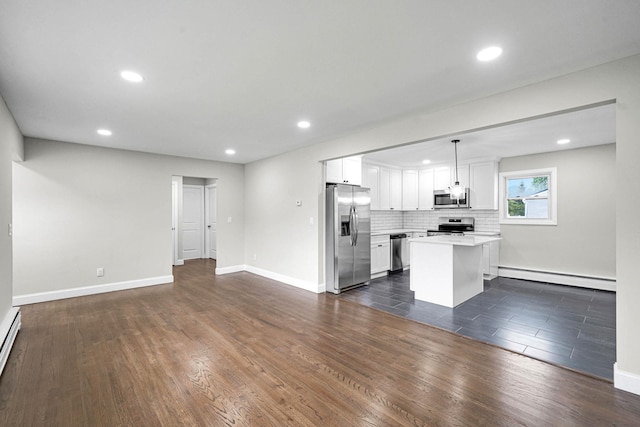 unfurnished living room featuring a baseboard radiator, dark wood-style floors, recessed lighting, baseboards, and baseboard heating