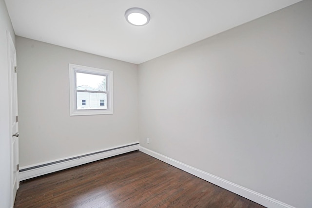 unfurnished room with a baseboard radiator, dark wood-style flooring, and baseboards