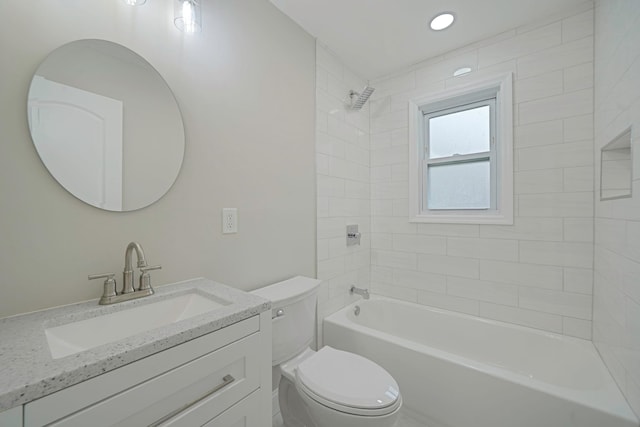 full bathroom featuring toilet, vanity, and bathtub / shower combination