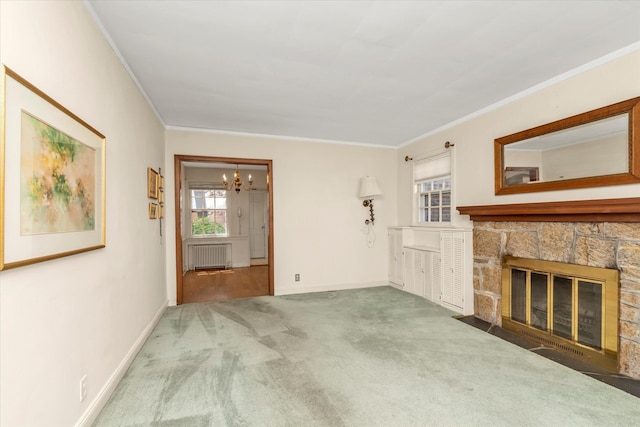 unfurnished living room featuring radiator heating unit, ornamental molding, carpet flooring, a chandelier, and baseboards