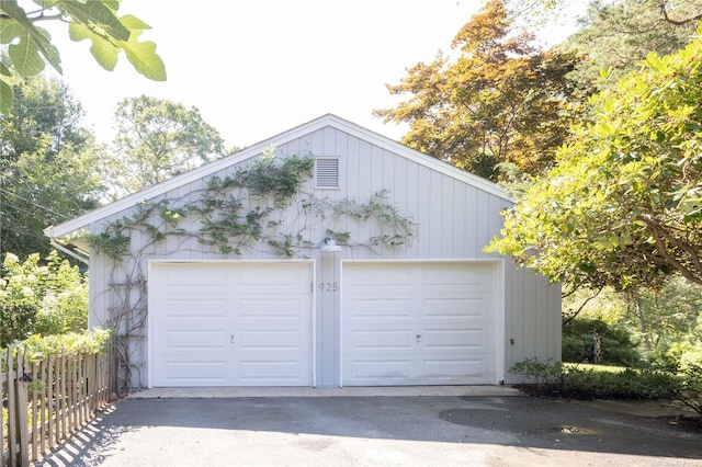 detached garage with fence