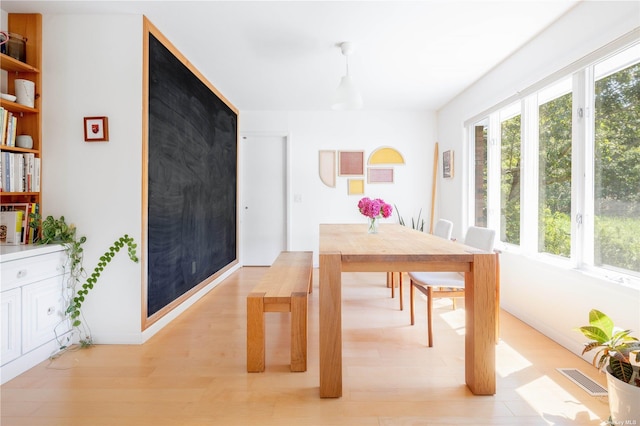 dining room with light wood-style flooring