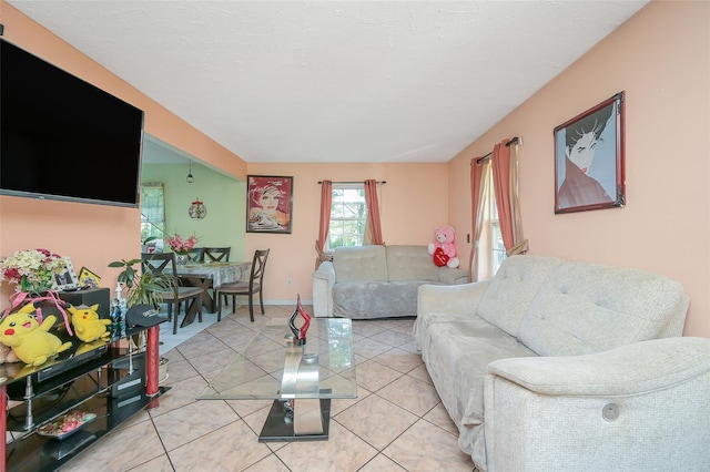 living room with baseboards and light tile patterned flooring