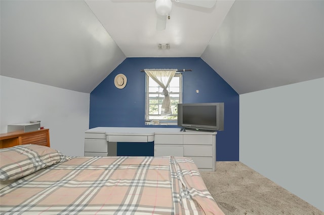 bedroom with carpet, vaulted ceiling, and a ceiling fan