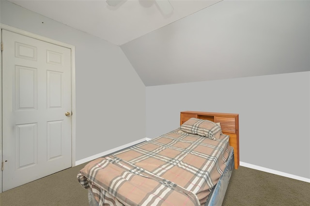 carpeted bedroom featuring vaulted ceiling, ceiling fan, and baseboards