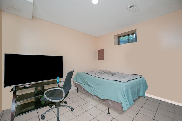 bedroom with visible vents and tile patterned flooring