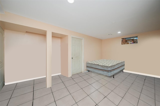 bedroom with baseboards, light tile patterned floors, and recessed lighting