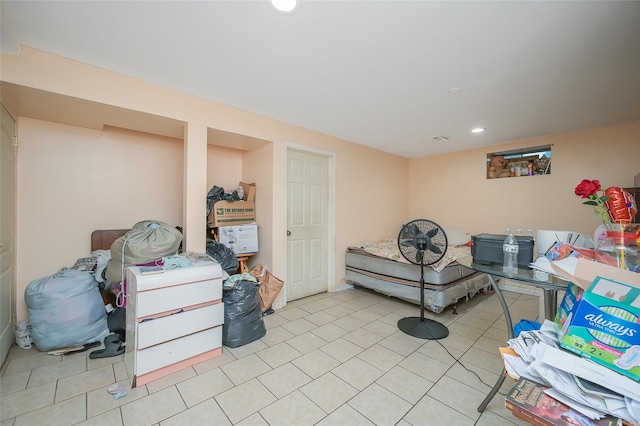 finished below grade area with recessed lighting and light tile patterned flooring