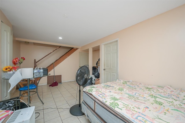 bedroom featuring light tile patterned flooring and recessed lighting