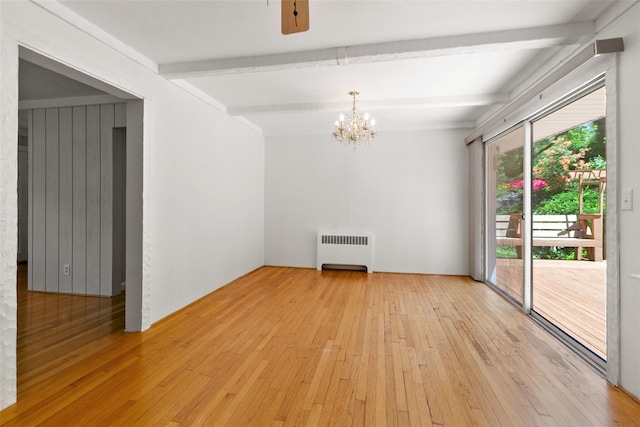 202 W Main St, Mount Kisco, NY 10549 - empty room featuring radiator heating unit, beamed ceiling, light wood-style floors, and a chandelier