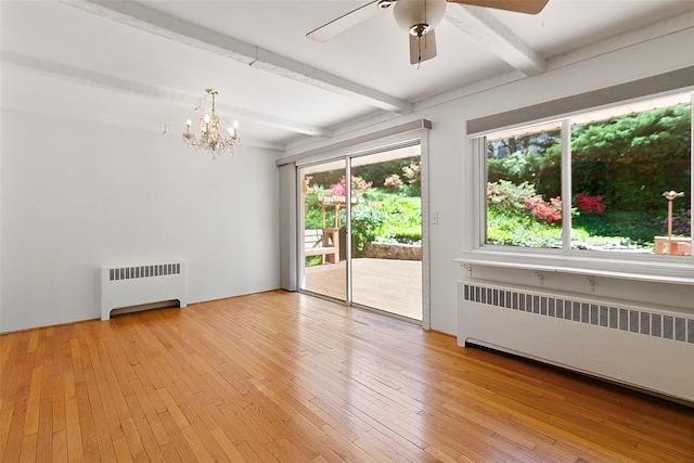 202 W Main St, Mount Kisco, NY 10549 - spare room with radiator, beamed ceiling, a chandelier, ceiling fan, and light wood finished floors
