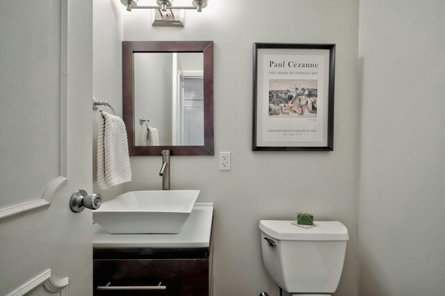 bathroom with toilet and vanity