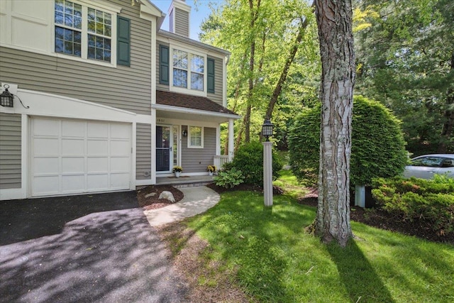 1601 Pondcrest Ln, White Plains, NY 10607 - view of front facade featuring a garage, a front yard, and a porch