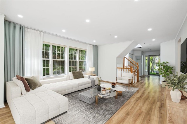 1601 Pondcrest Ln, White Plains, NY 10607 - living room with stairs, light wood-style flooring, recessed lighting, and ornamental molding