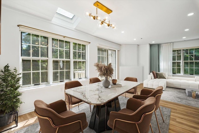 1601 Pondcrest Ln, White Plains, NY 10607 - dining room featuring plenty of natural light, a skylight, wood finished floors, a chandelier, and recessed lighting
