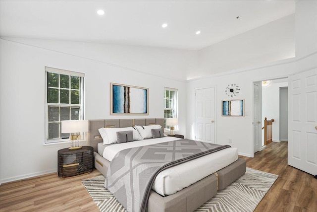 1601 Pondcrest Ln, White Plains, NY 10607 - bedroom with multiple windows, wood finished floors, recessed lighting, and baseboards