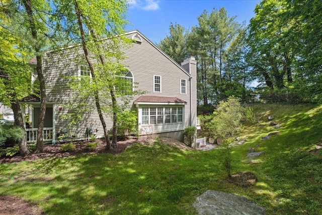 1601 Pondcrest Ln, White Plains, NY 10607 - back of property with a chimney and a yard