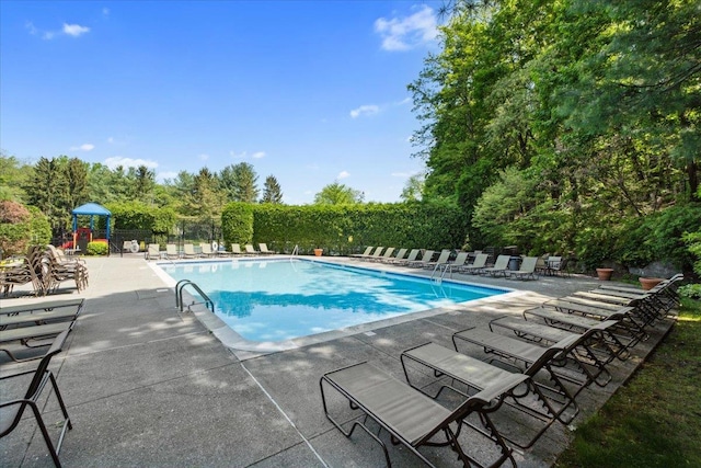 1601 Pondcrest Ln, White Plains, NY 10607 - community pool with a patio and fence