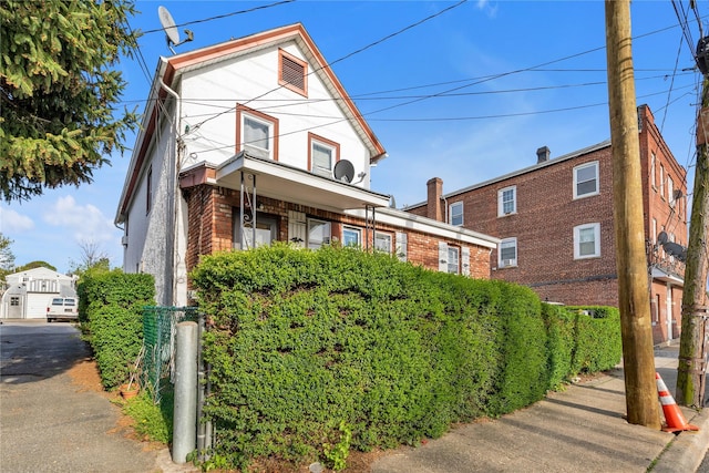 traditional-style house featuring brick siding