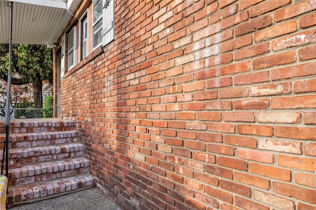 view of side of property with brick siding