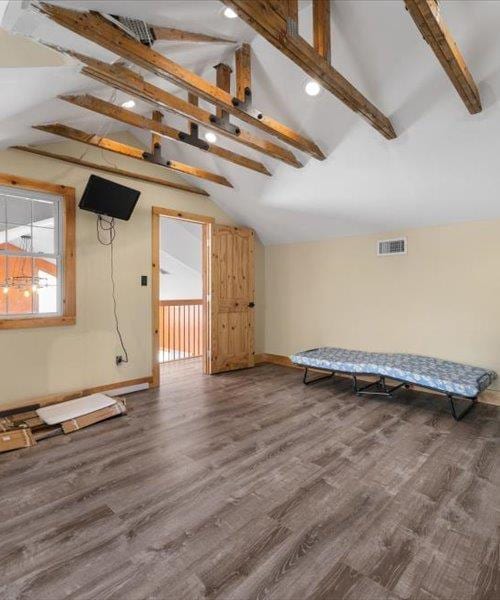 bonus room with wood finished floors and baseboards