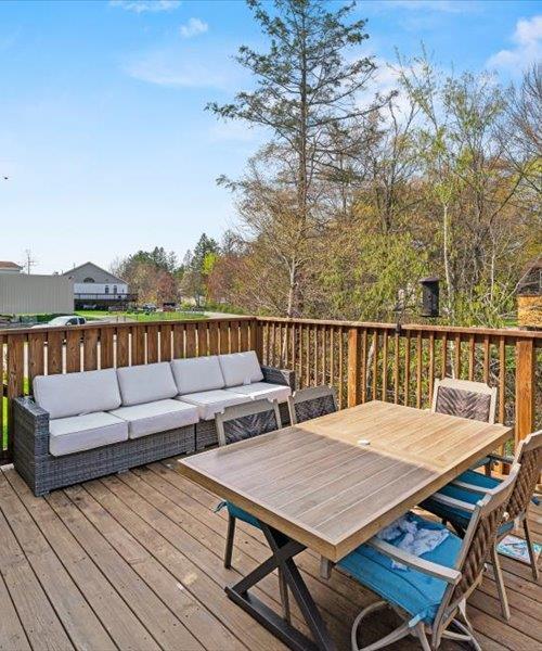 wooden deck with outdoor lounge area and outdoor dining space