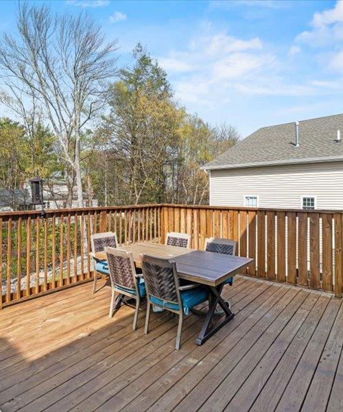 wooden deck featuring outdoor dining area