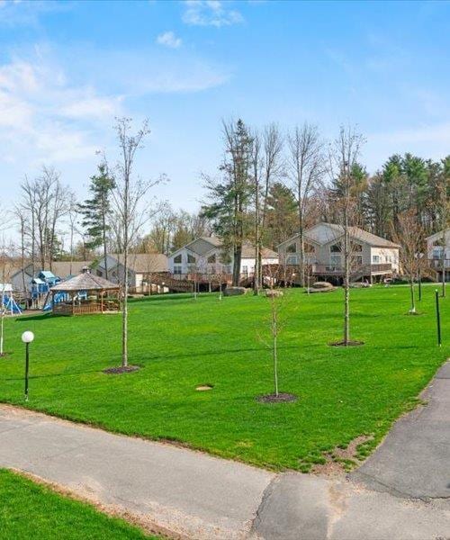 surrounding community with a yard