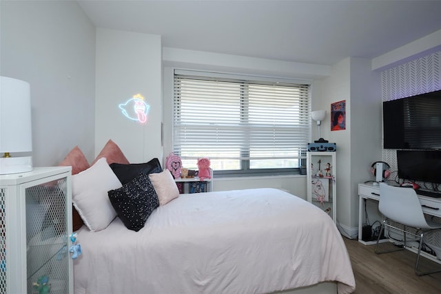 bedroom featuring wood finished floors