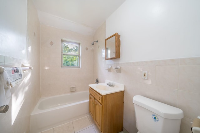 bathroom featuring toilet, shower / tub combination, tile patterned floors, tile walls, and vanity