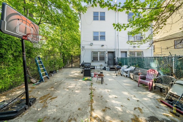 back of property featuring a patio area and a fenced backyard