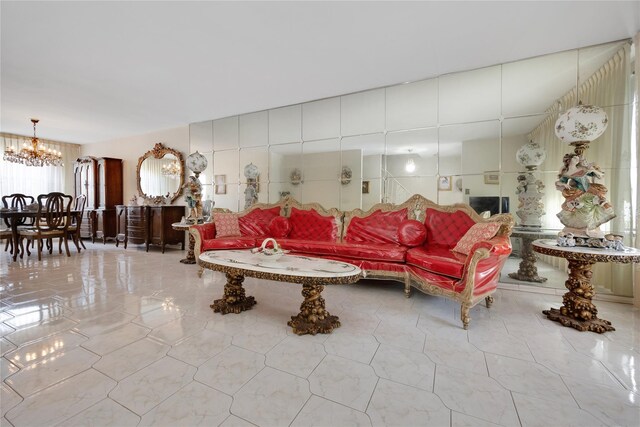 living room featuring a chandelier and tile patterned floors