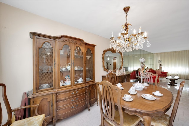 dining area featuring a notable chandelier